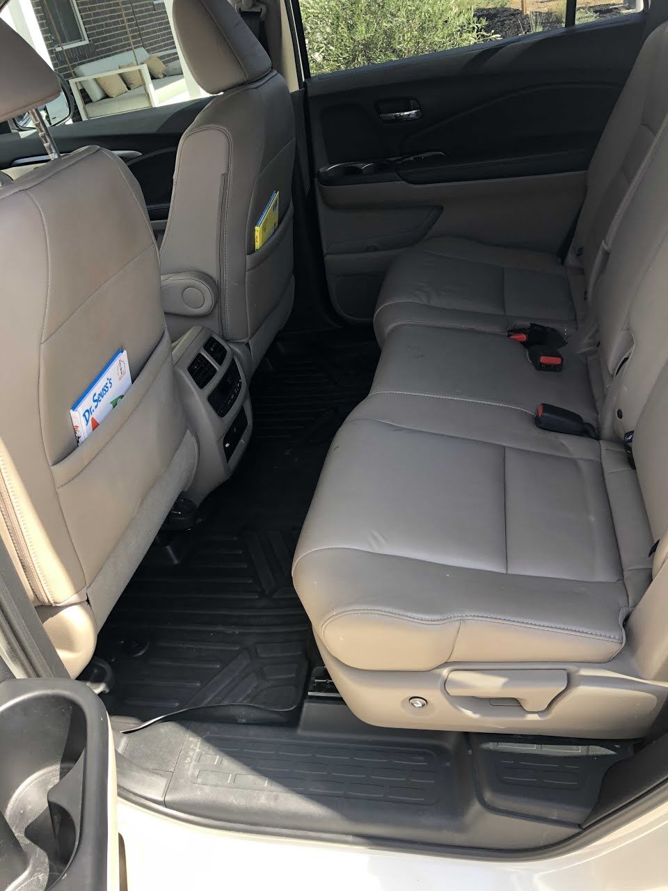 Honda Pilot backseat after the interior detail in Encinitas, shampooed mats and conditioned leather